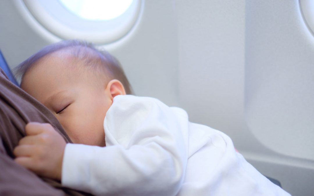 Korean baby nursing on a plane