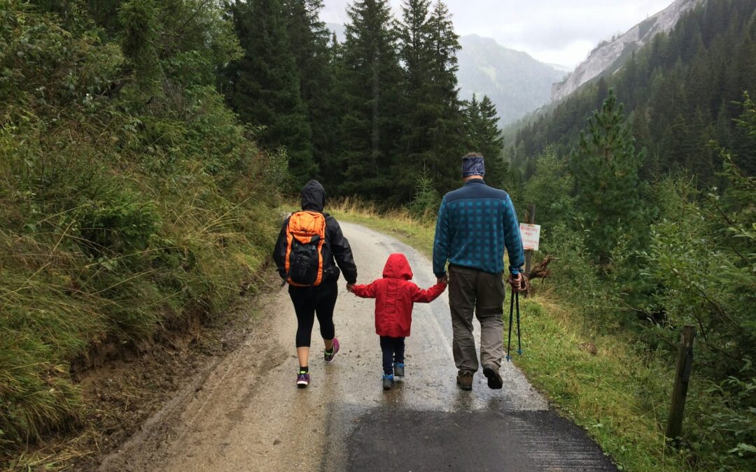 photo of family hiking down trail